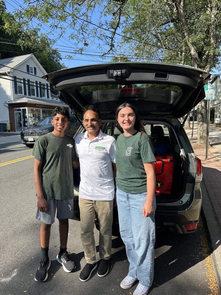 Madelyn Boglioli, Praveen Vuppala and his son of Robbins Pharmacy supporting our school supply program